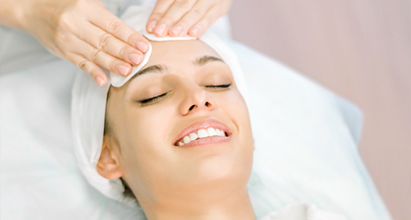 woman enjoying a facial treatment with gentle massage for relaxation and skincare benefits