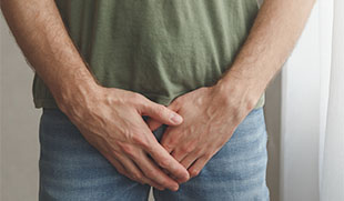 person applying Eflornithine cream to fingers for hair removal treatment with focus on skincare routine and beauty 11 benefits of Eflornithine