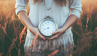 man holding hands over groin wearing green shirt and blue jeans related to twelve health awareness